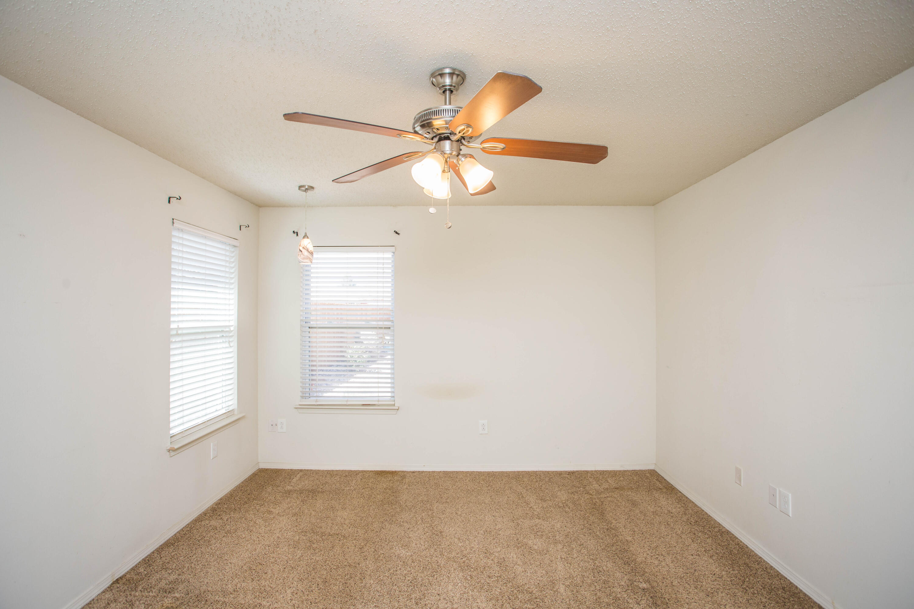 6114 22nd Street, Unit 2 Lubbock, TX 79407 - Photo 35 of 48 an empty room with windows and fan