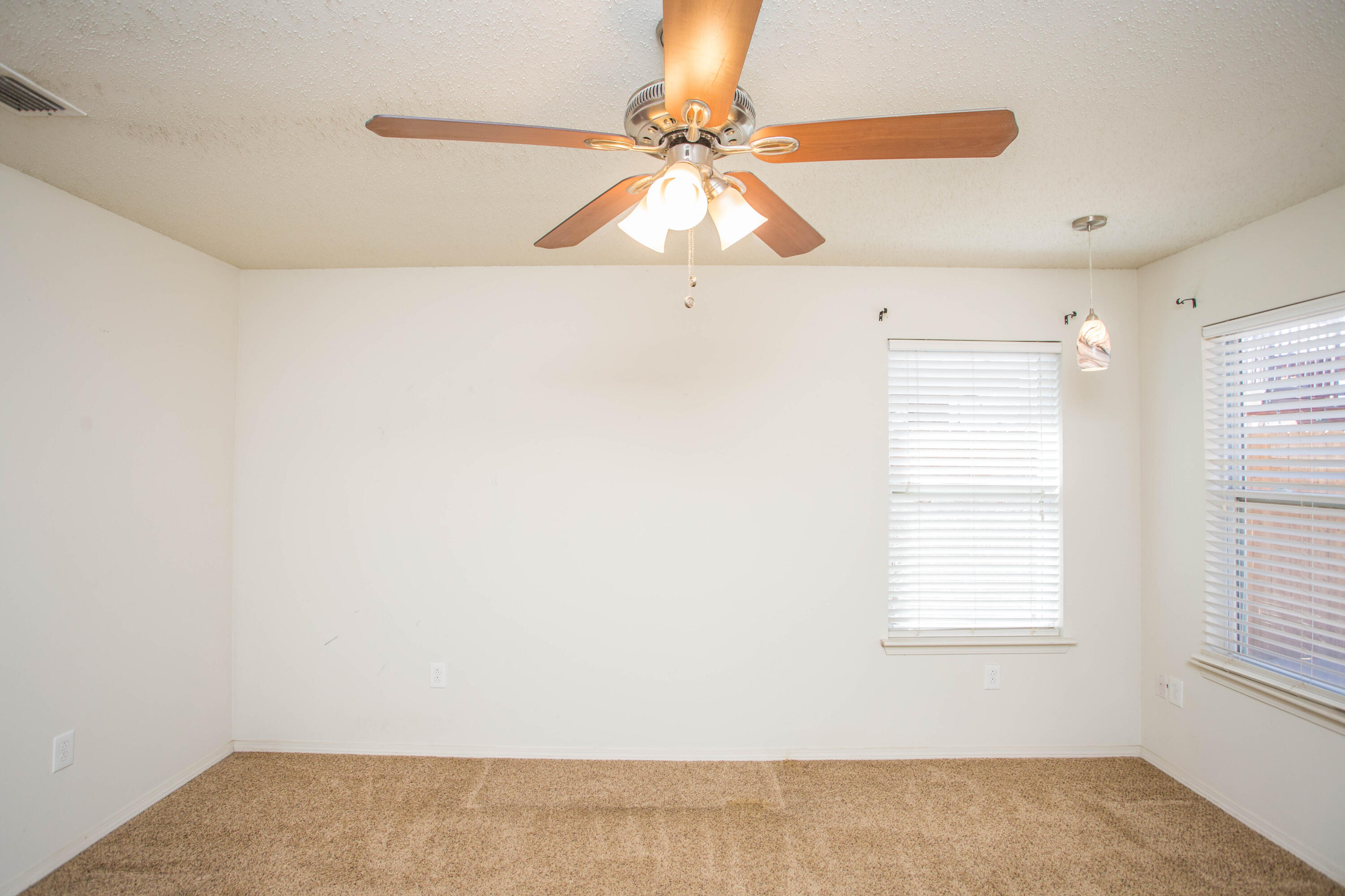 6114 22nd Street, Unit 2 Lubbock, TX 79407 - Photo 37 of 48 a view of an empty room and window