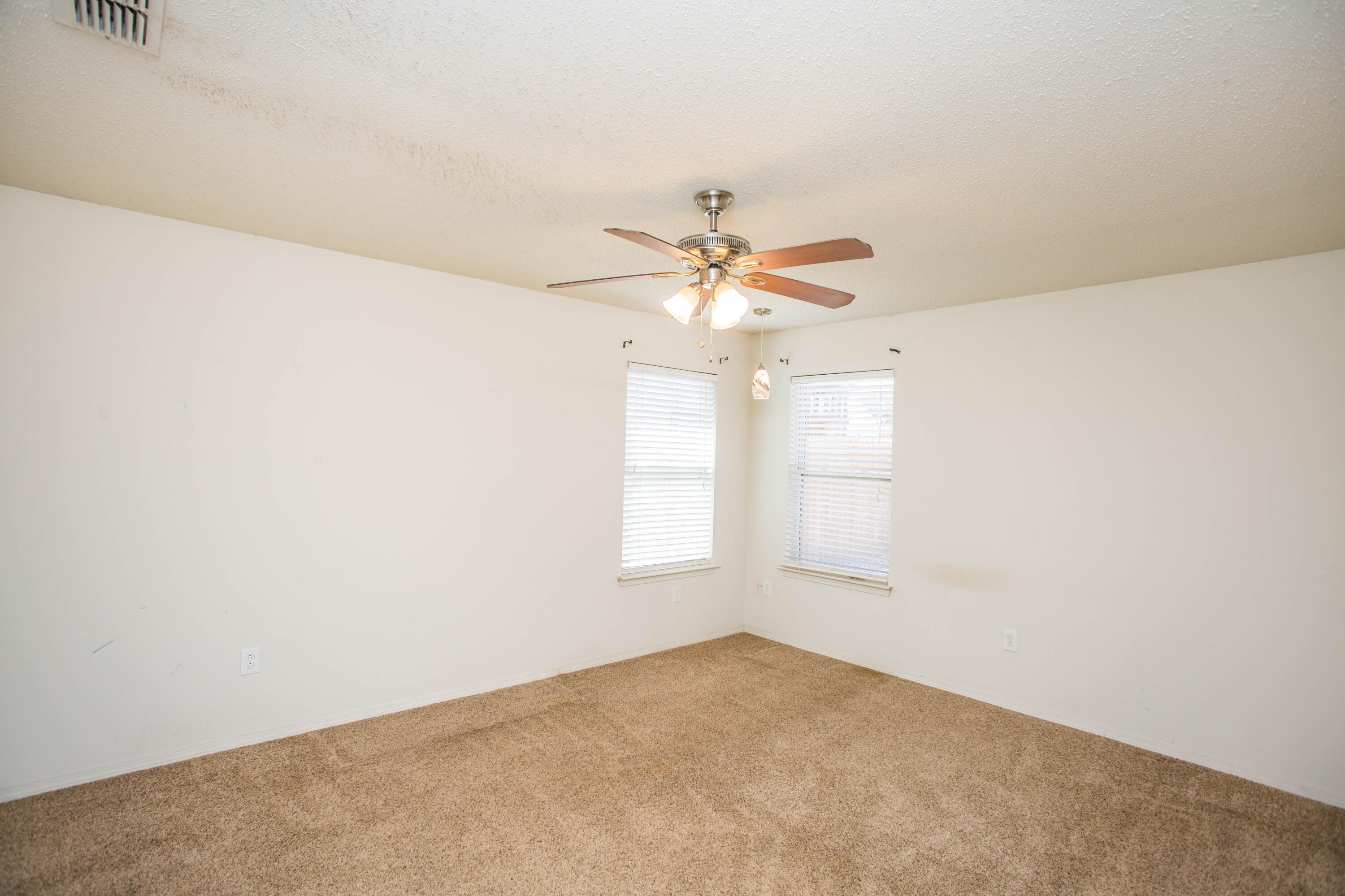 6114 22nd Street, Unit 2 Lubbock, TX 79407 - Photo 38 of 48 an empty room with windows and fan
