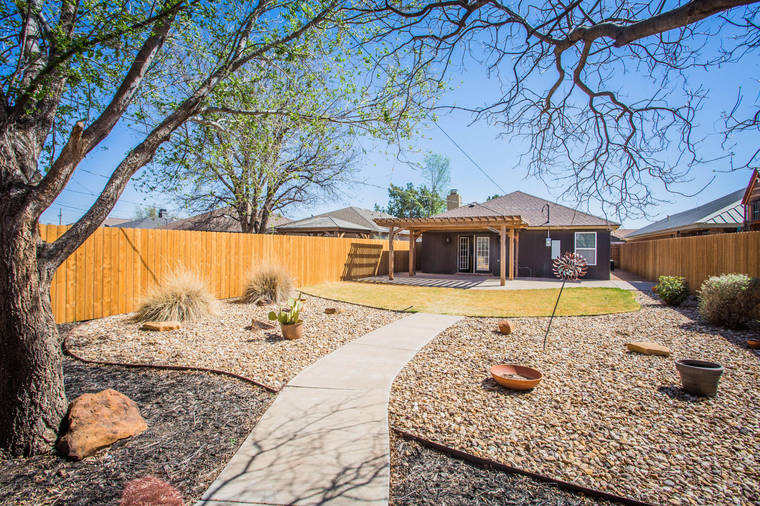 6114 22nd Street, Unit 2 Lubbock, TX 79407 - Photo 43 of 48 a view of swimming pool with a lounge chair