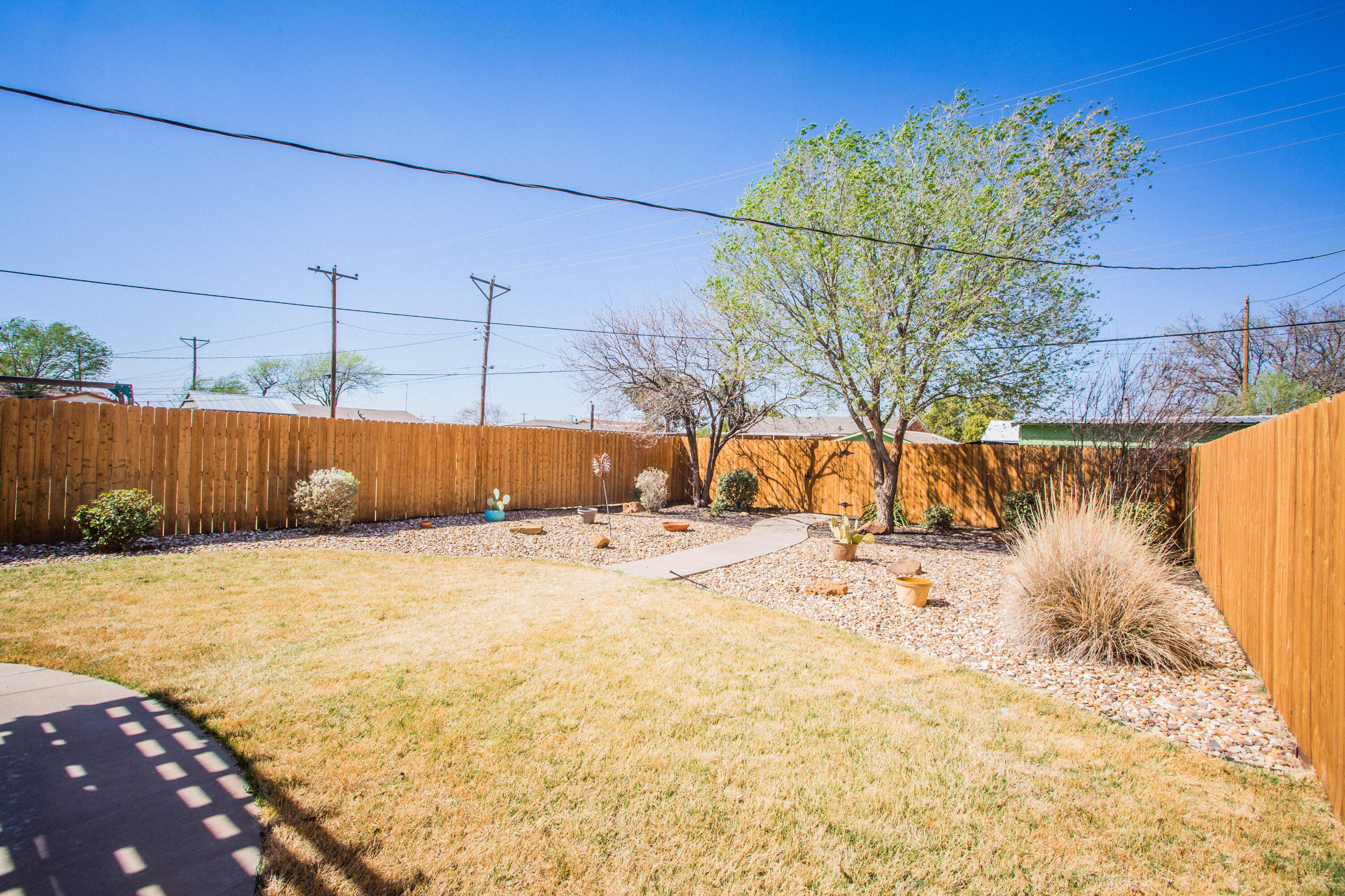 6114 22nd Street, Unit 2 Lubbock, TX 79407 - Photo 46 of 48 a view of a backyard of the house
