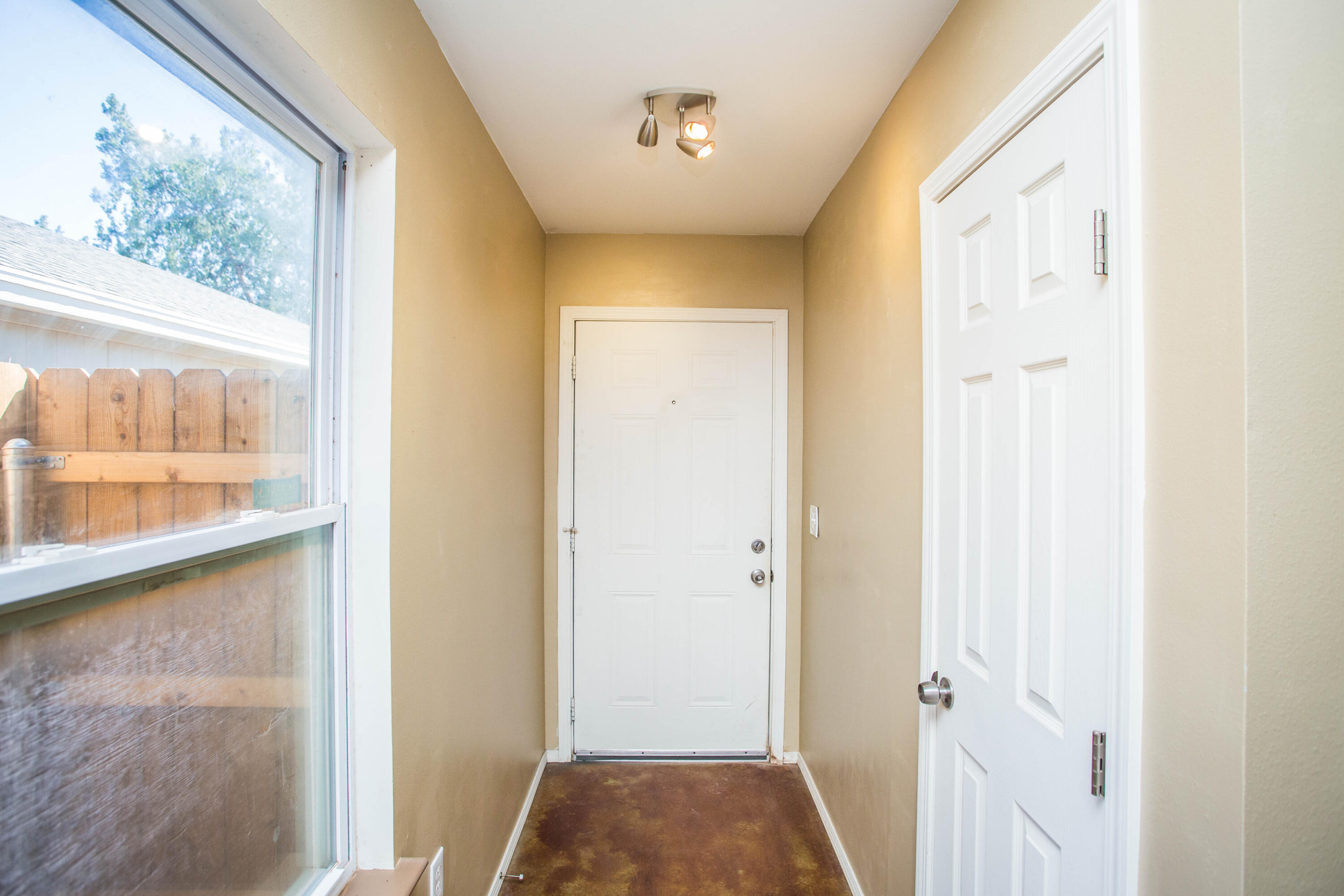 6114 22nd Street, Unit 2 Lubbock, TX 79407 - Photo 6 of 48 a view of bedroom with a bed and wooden floor