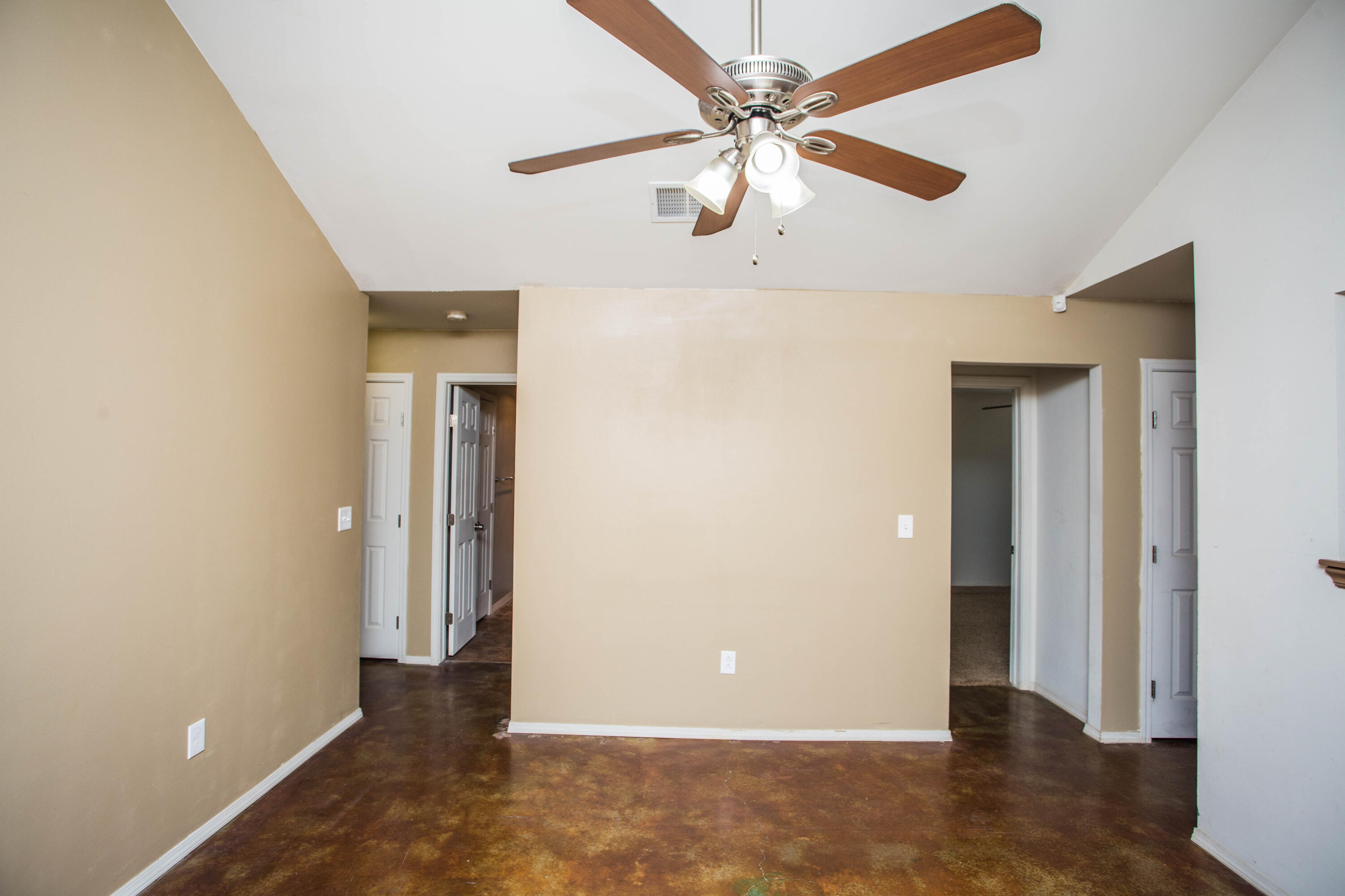 6114 22nd Street, Unit 2 Lubbock, TX 79407 - Photo 8 of 48 an empty room with closet and a chandelier fan