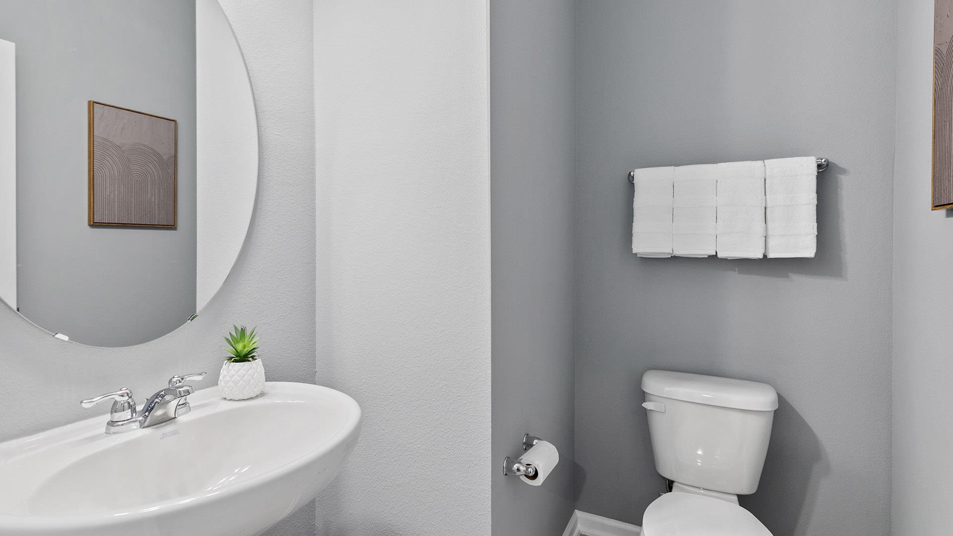 280 Redbud Road Palm Coast, FL 32137 - Photo 32 of 41 a bathroom with a toilet sink and mirror
