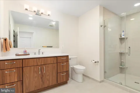 a bathroom with a toilet sink and shower