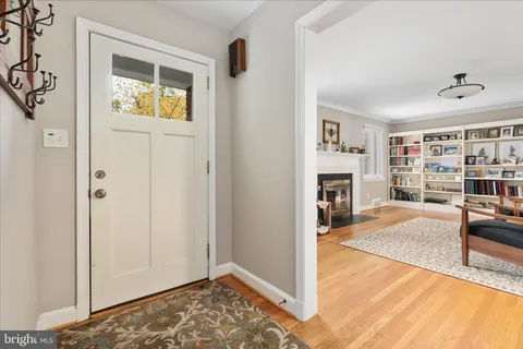 a view of living room with furniture and fireplace