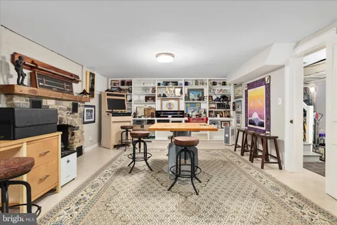 a living room with furniture a rug and a large window