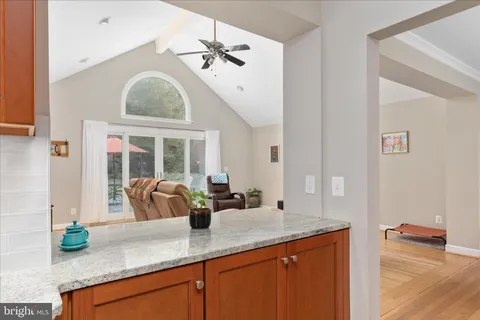a kitchen with granite countertop a sink and a large window