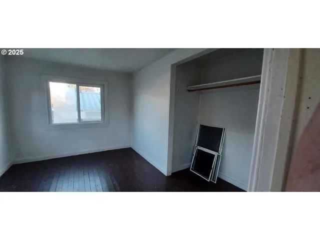 a hallway with table and chairs