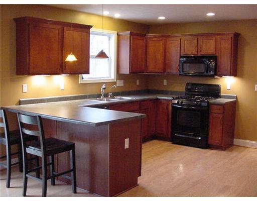 Kitchen. Gleeming Hardwood Floors, Crown Molding, Recessed and Under Cabinet Lighting, Stainless Steel Sink PLUS Appliances!!