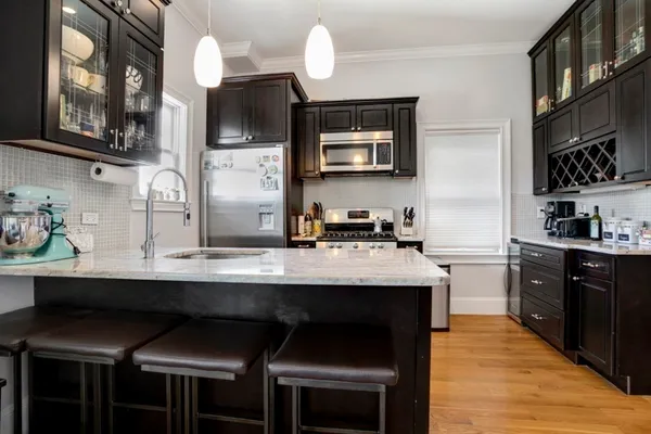 a kitchen with a sink cabinets and window