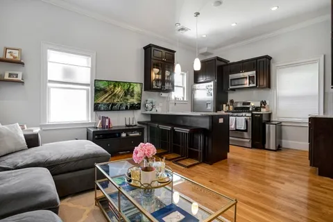 a living room with furniture and windows