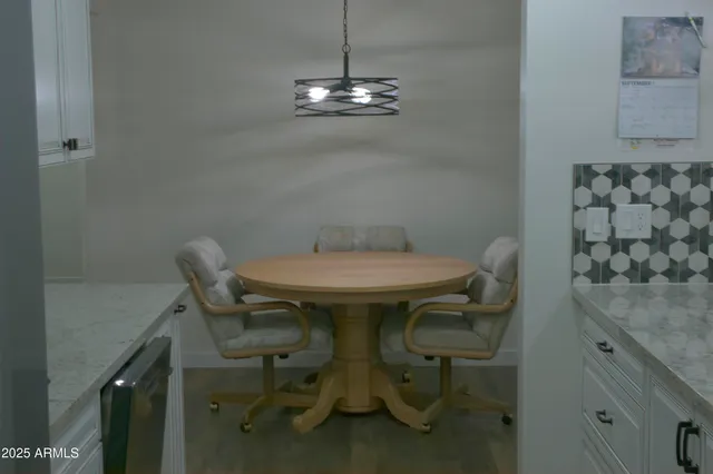 a kitchen with a sink and refrigerator