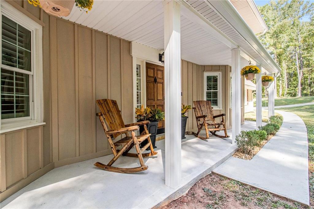 160 Old Field Road Sharpsburg, GA 30277 - Photo 14 of 58 a view of a dinning room with furniture and floor to ceiling window