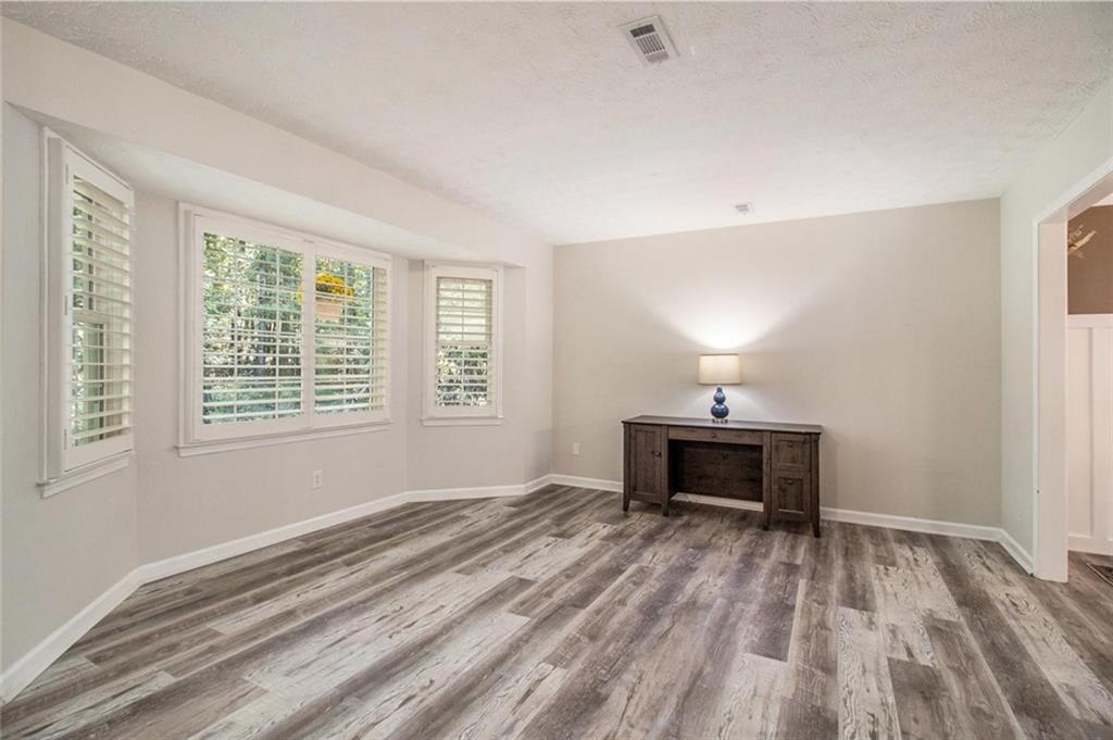 160 Old Field Road Sharpsburg, GA 30277 - Photo 16 of 58 a bedroom with a bed and a window