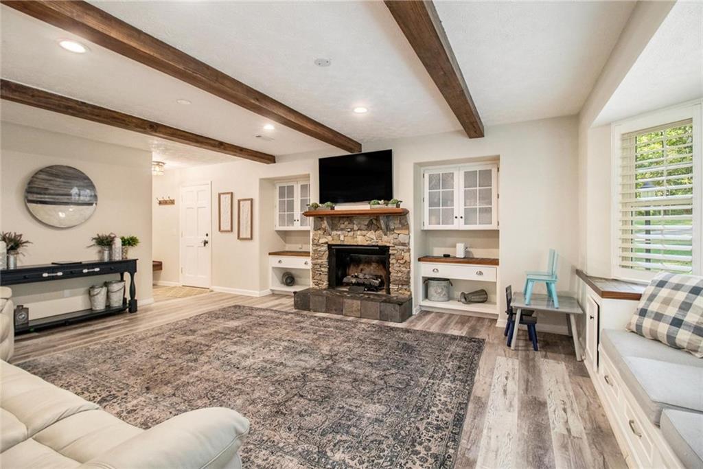 160 Old Field Road Sharpsburg, GA 30277 - Photo 17 of 58 a living room with furniture a flat screen tv and a fireplace