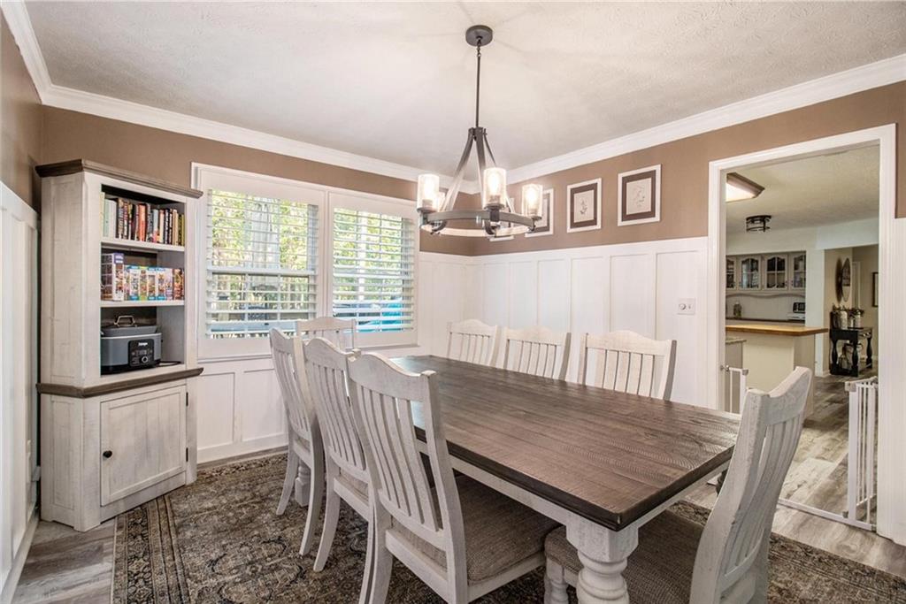 160 Old Field Road Sharpsburg, GA 30277 - Photo 20 of 58 a view of a dining room with furniture window and wooden floor