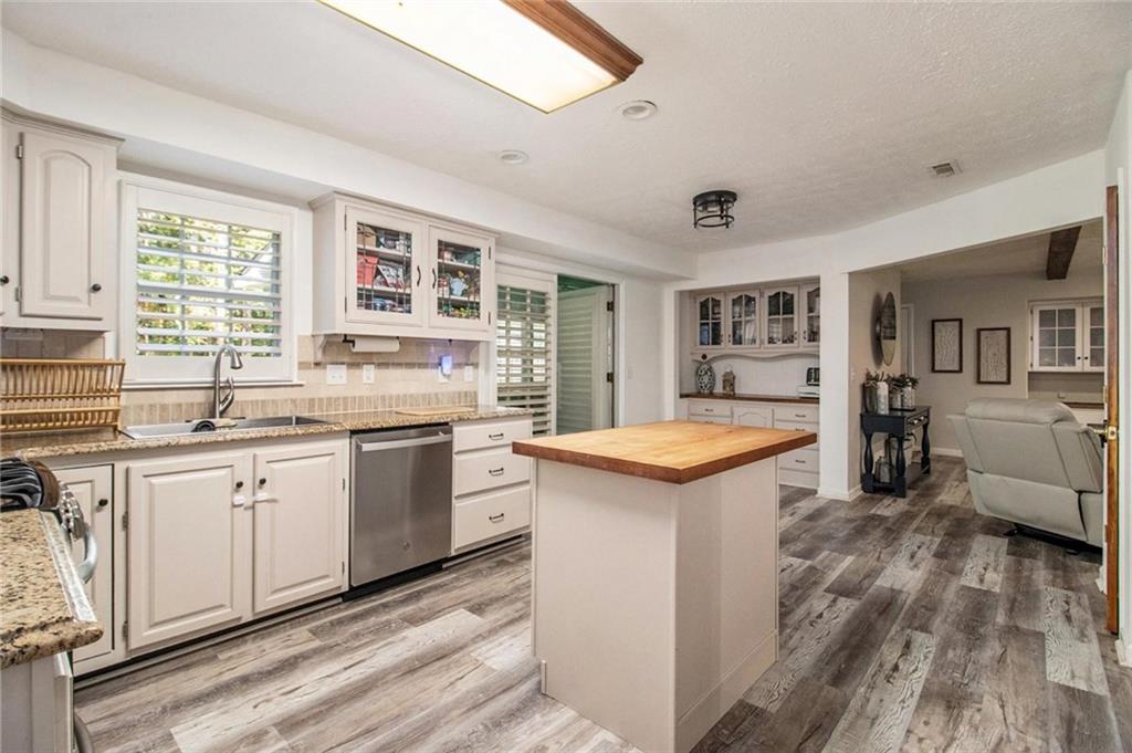 160 Old Field Road Sharpsburg, GA 30277 - Photo 21 of 58 a kitchen with a stove and a sink