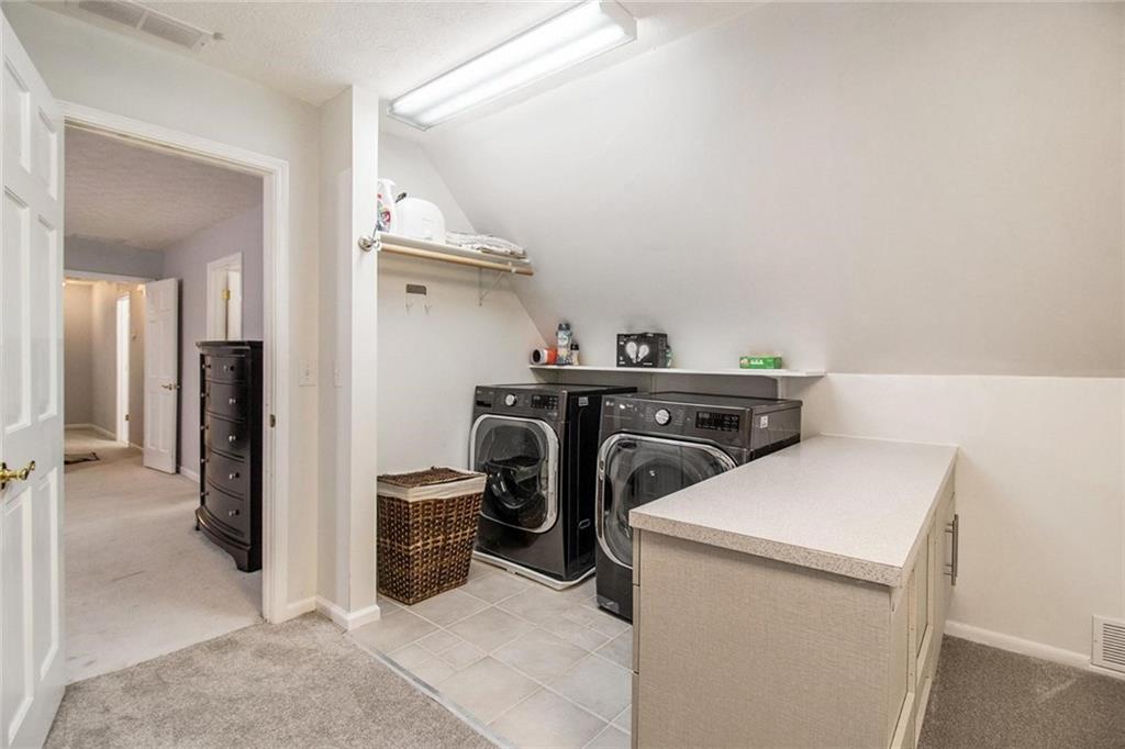 160 Old Field Road Sharpsburg, GA 30277 - Photo 32 of 58 a utility room with dryer and washer