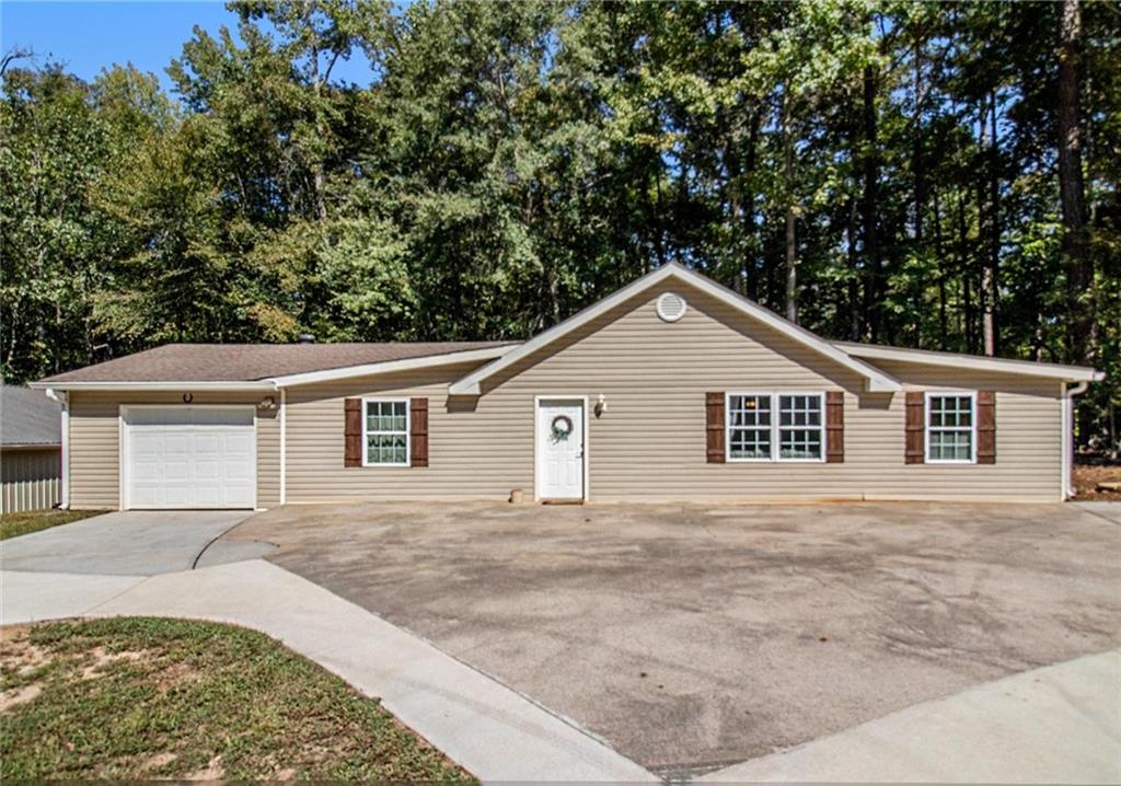 160 Old Field Road Sharpsburg, GA 30277 - Photo 38 of 58 front view of a house with a yard