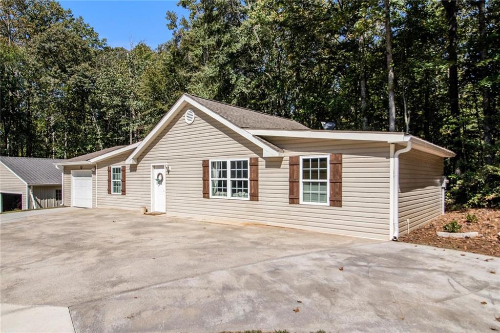 160 Old Field Road Sharpsburg, GA 30277 - Photo 39 of 58 a front view of a house with a garden