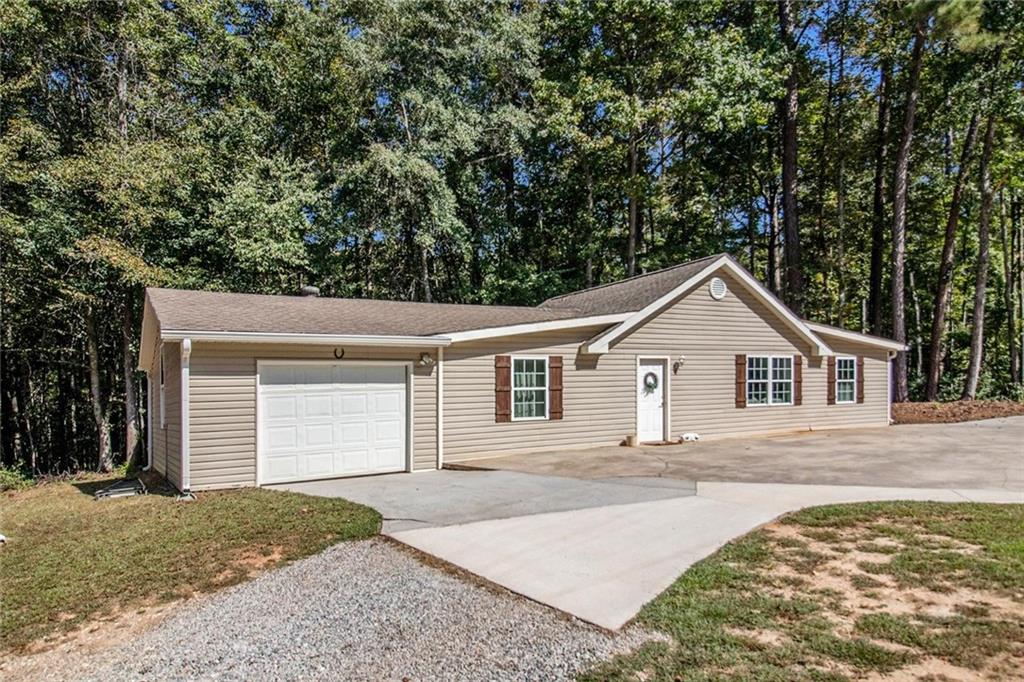 160 Old Field Road Sharpsburg, GA 30277 - Photo 40 of 58 front view of a house with a yard