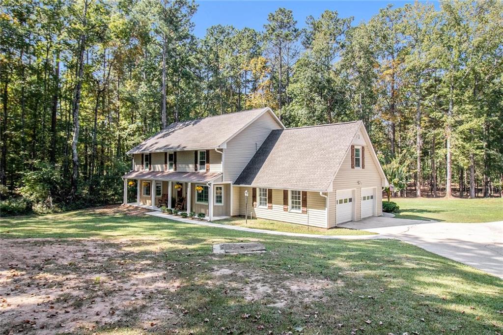160 Old Field Road Sharpsburg, GA 30277 - Photo 4 of 58 a view of a house with a yard
