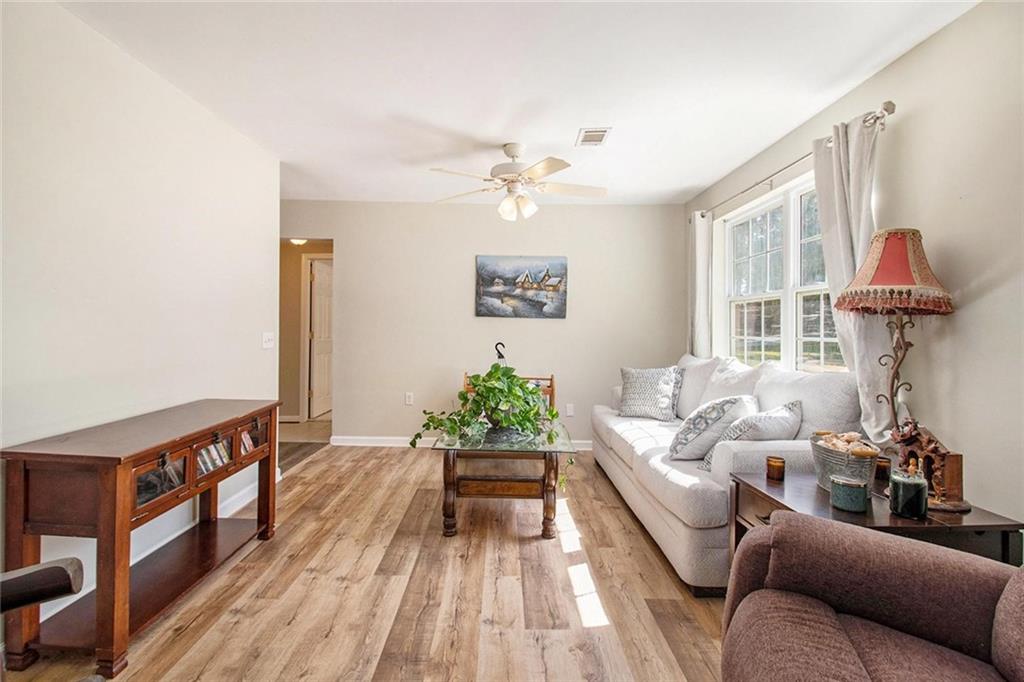 160 Old Field Road Sharpsburg, GA 30277 - Photo 45 of 58 a living room with furniture and a chandelier