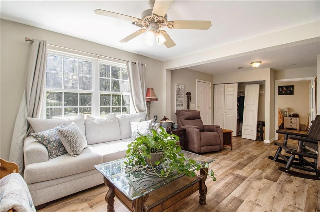 160 Old Field Road Sharpsburg, GA 30277 - Photo 46 of 58 a living room with furniture and a large window