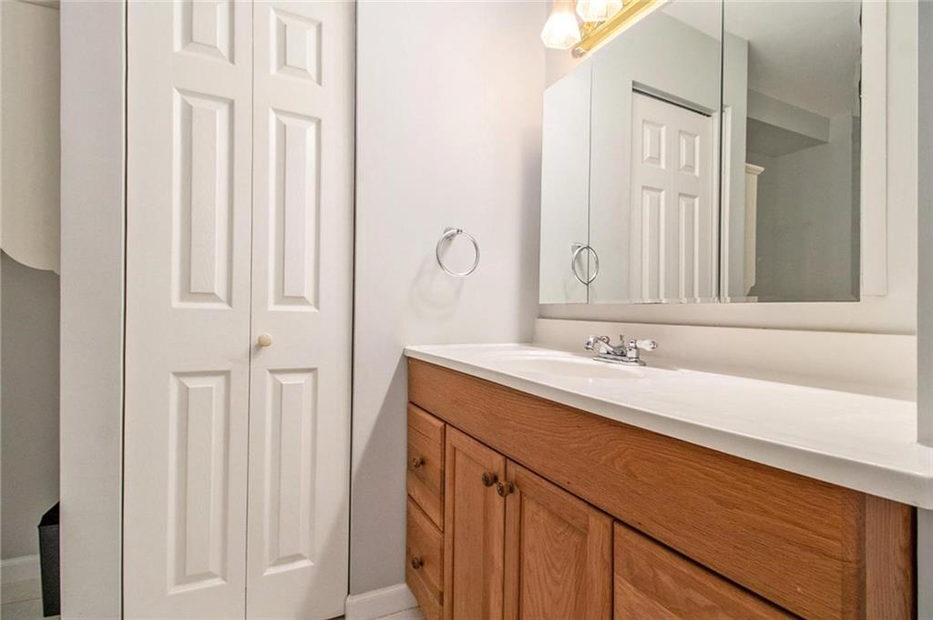 160 Old Field Road Sharpsburg, GA 30277 - Photo 51 of 58 a bathroom with a double vanity sink and a mirror