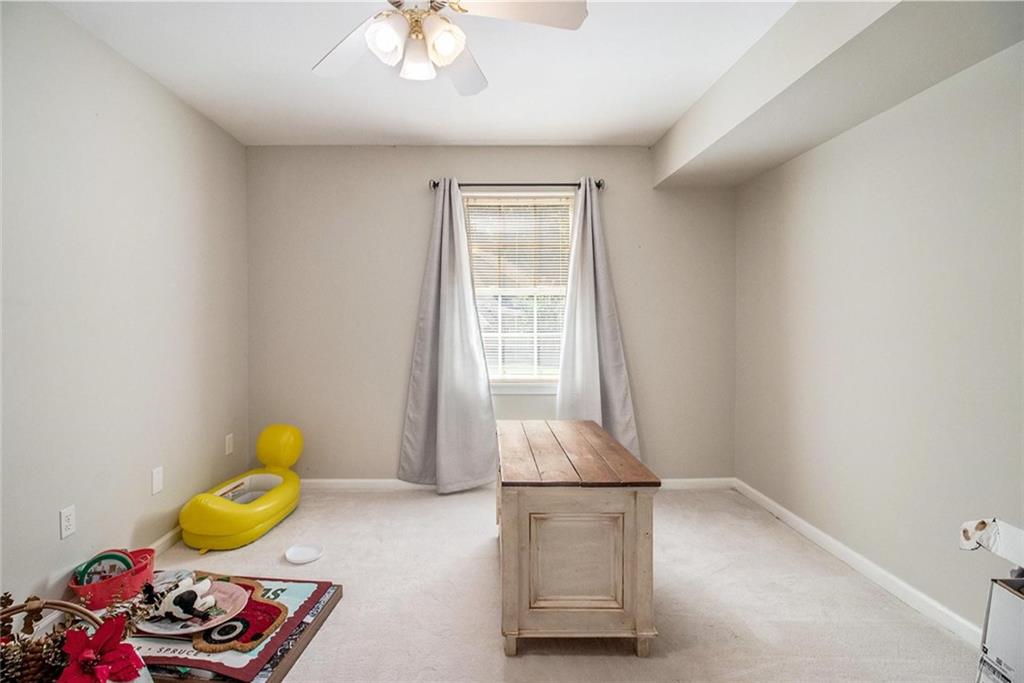 160 Old Field Road Sharpsburg, GA 30277 - Photo 52 of 58 a room with toys and a table