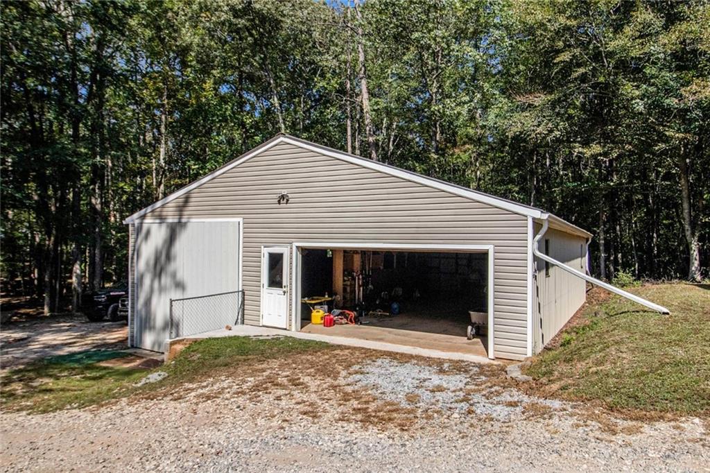 160 Old Field Road Sharpsburg, GA 30277 - Photo 57 of 58 a view of a white house with a yard and large tree