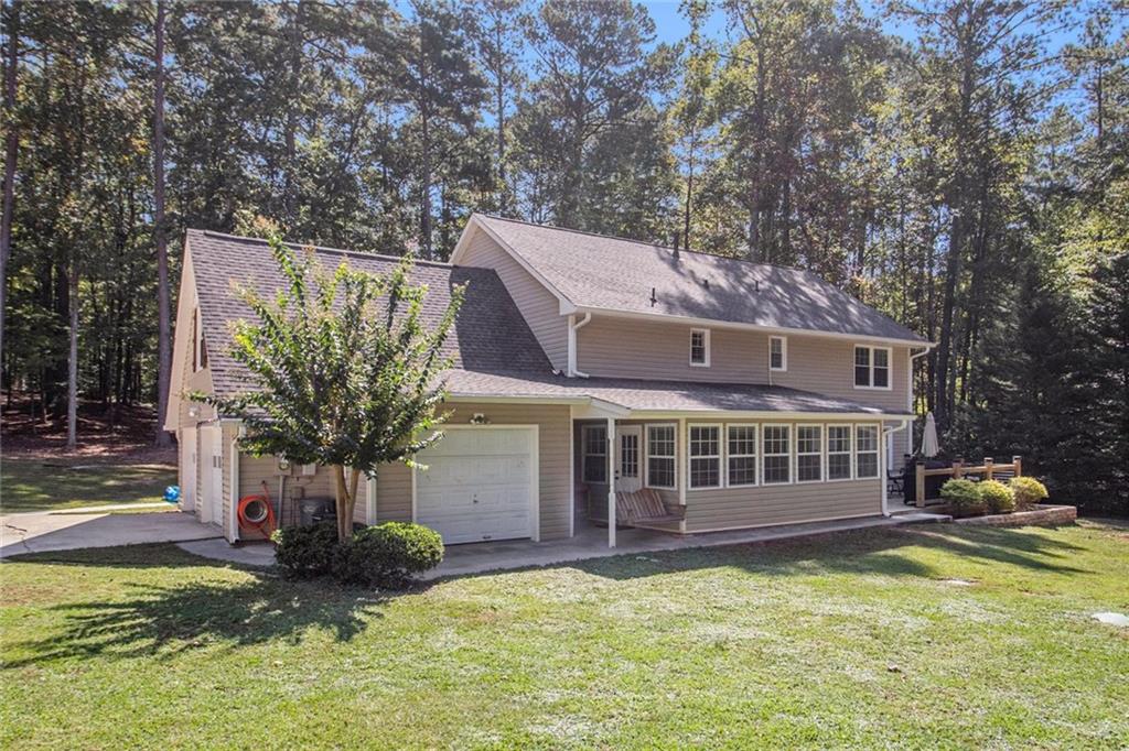 160 Old Field Road Sharpsburg, GA 30277 - Photo 8 of 58 a front view of house with yard swimming pool and outdoor seating