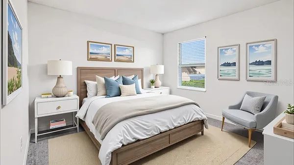 a bedroom with a bed and a couch