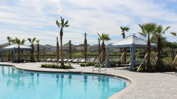 a view of a swimming pool with a patio
