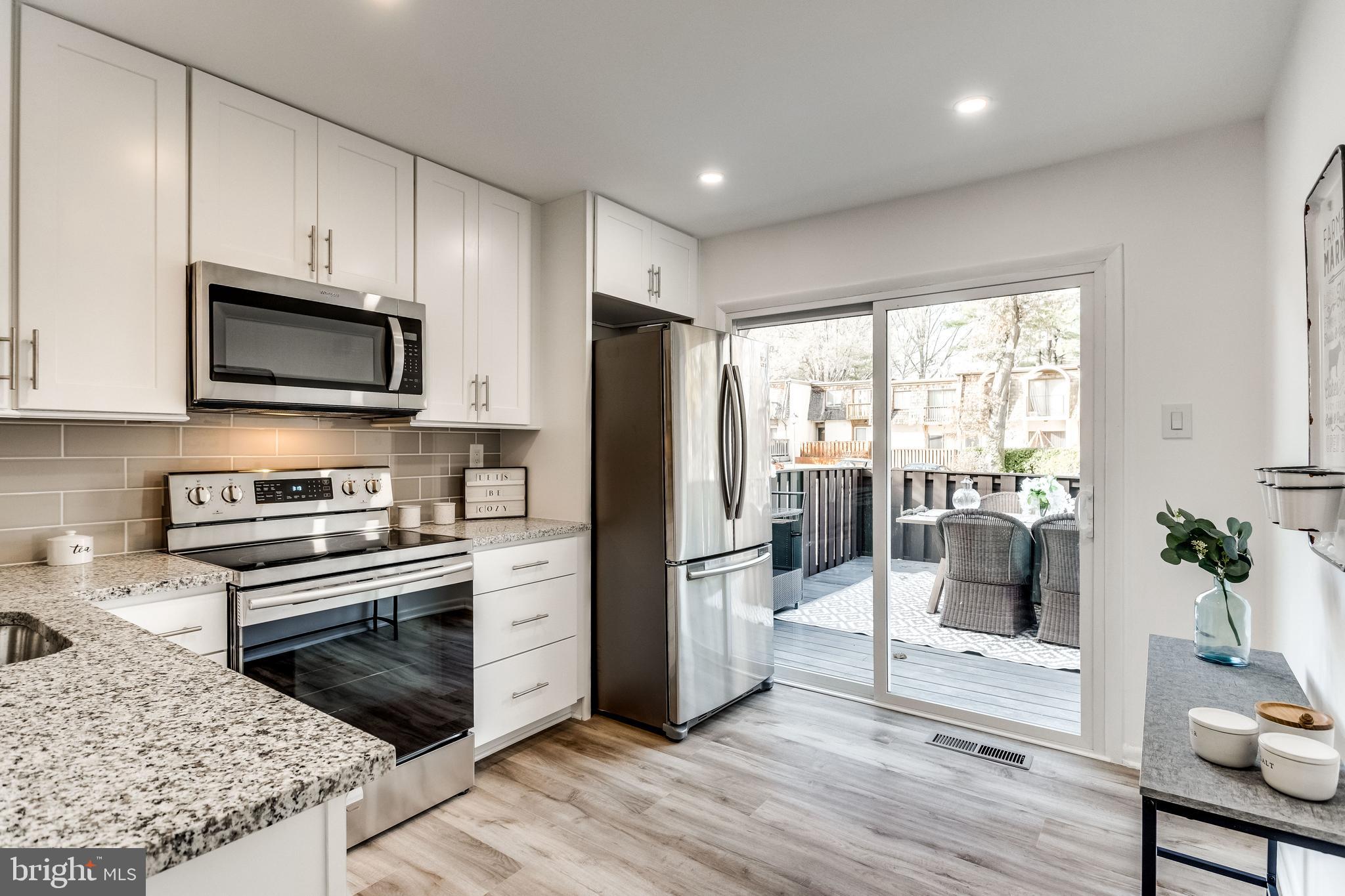 1666 Valencia Way Reston, VA 20190 - Photo 8 of 57 42" white shaker cabinets, French door fridge