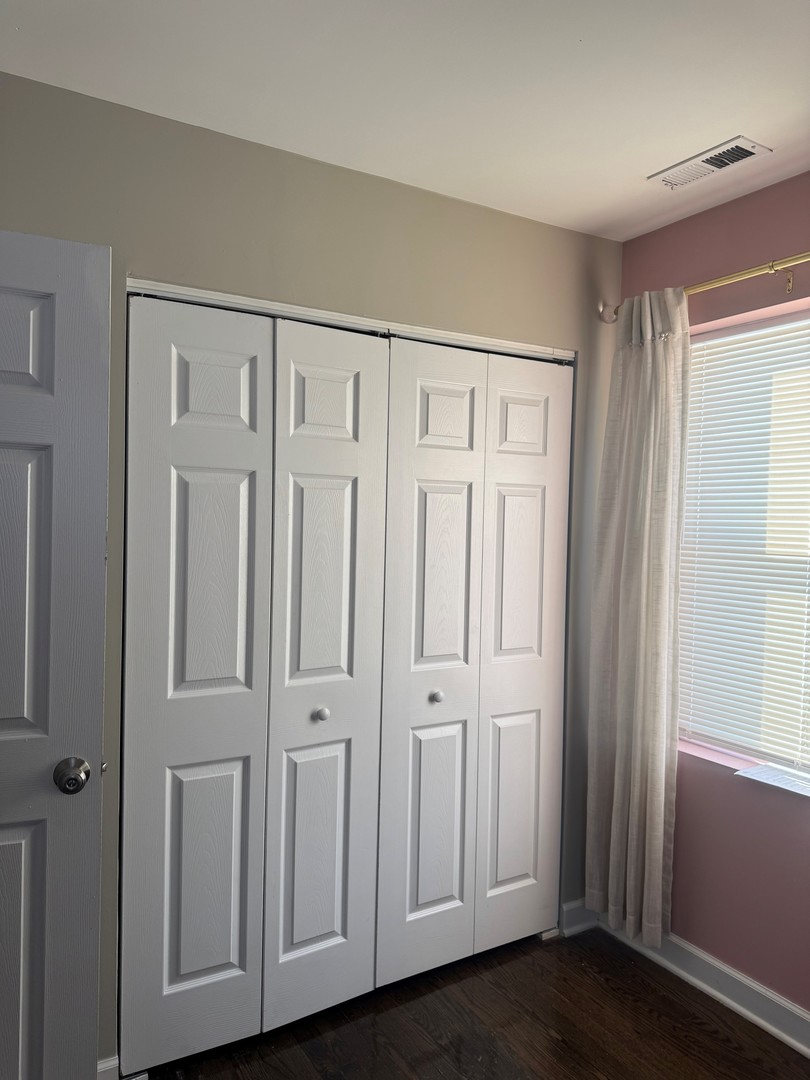 654 East 105th Street Chicago, IL 60628 - Photo 10 of 12 an entryway with wooden floor