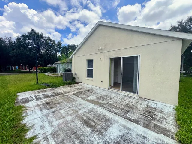 a view of a backyard of the house