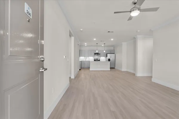 a view of a kitchen with a sink and a stove top oven