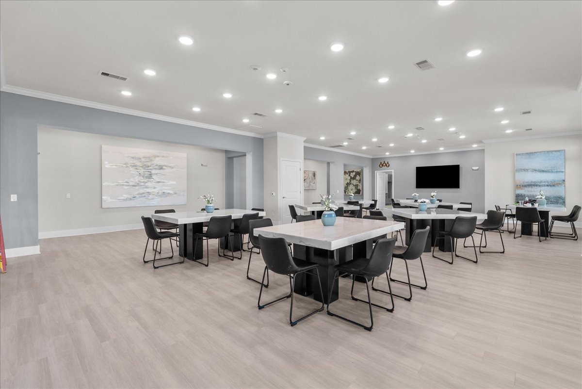 540 Hobbs Road, Unit E1 League City, TX 77573 - Photo 39 of 40 a view of a dining room with furniture window and wooden floor