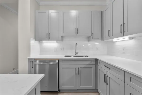 a room with gym equipment and a flat screen tv