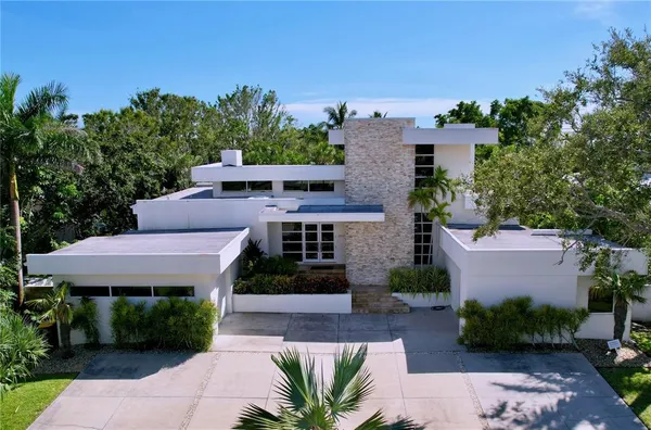 an aerial view of residential house with outdoor space and lake view