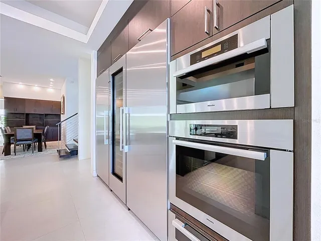 a bedroom with furniture and a mirror