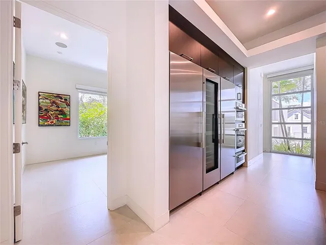 a bathroom with a sink and a large window