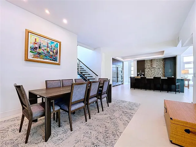a view of a hallway view with wooden floor and staircase