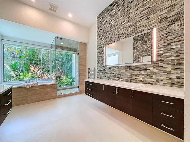 a room with gym equipment and a flat screen tv