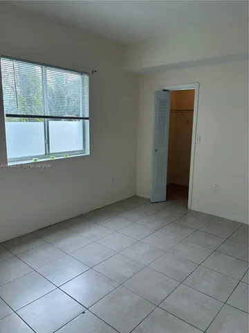 an empty room with a empty space and window