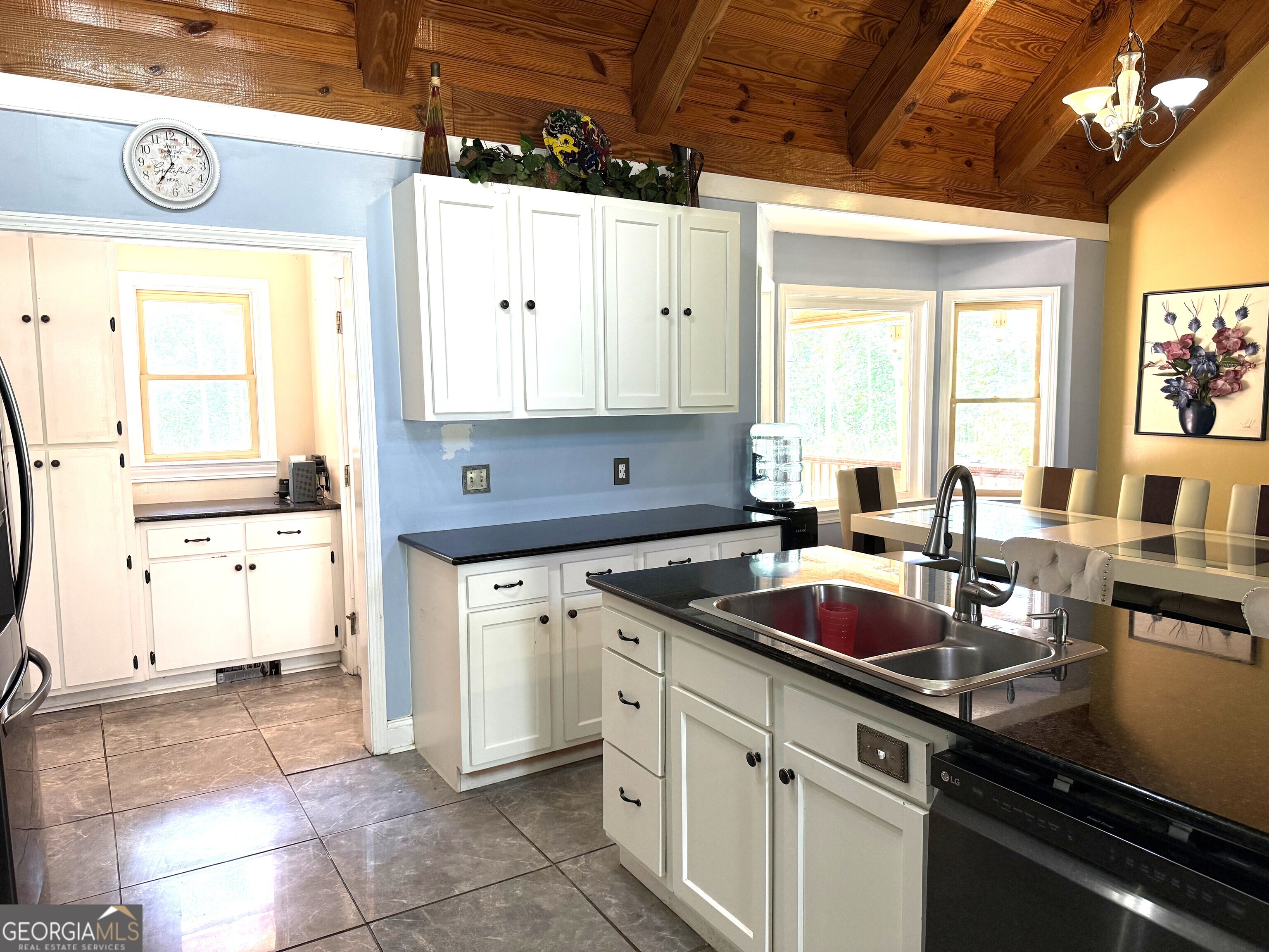 725 Musgrove Road Griffin, GA 30223 - Photo 11 of 52 a kitchen with a stove a sink and a refrigerator