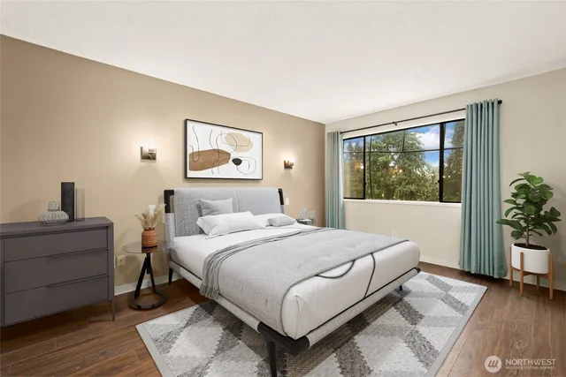 a bedroom with a large bed and a window