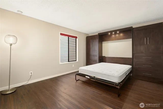 a room with pool table and window